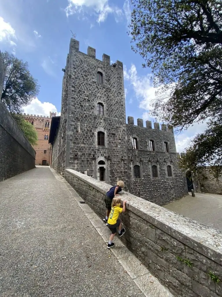 Kids Exploring Brolio Castle in Chianti. Tower in background.