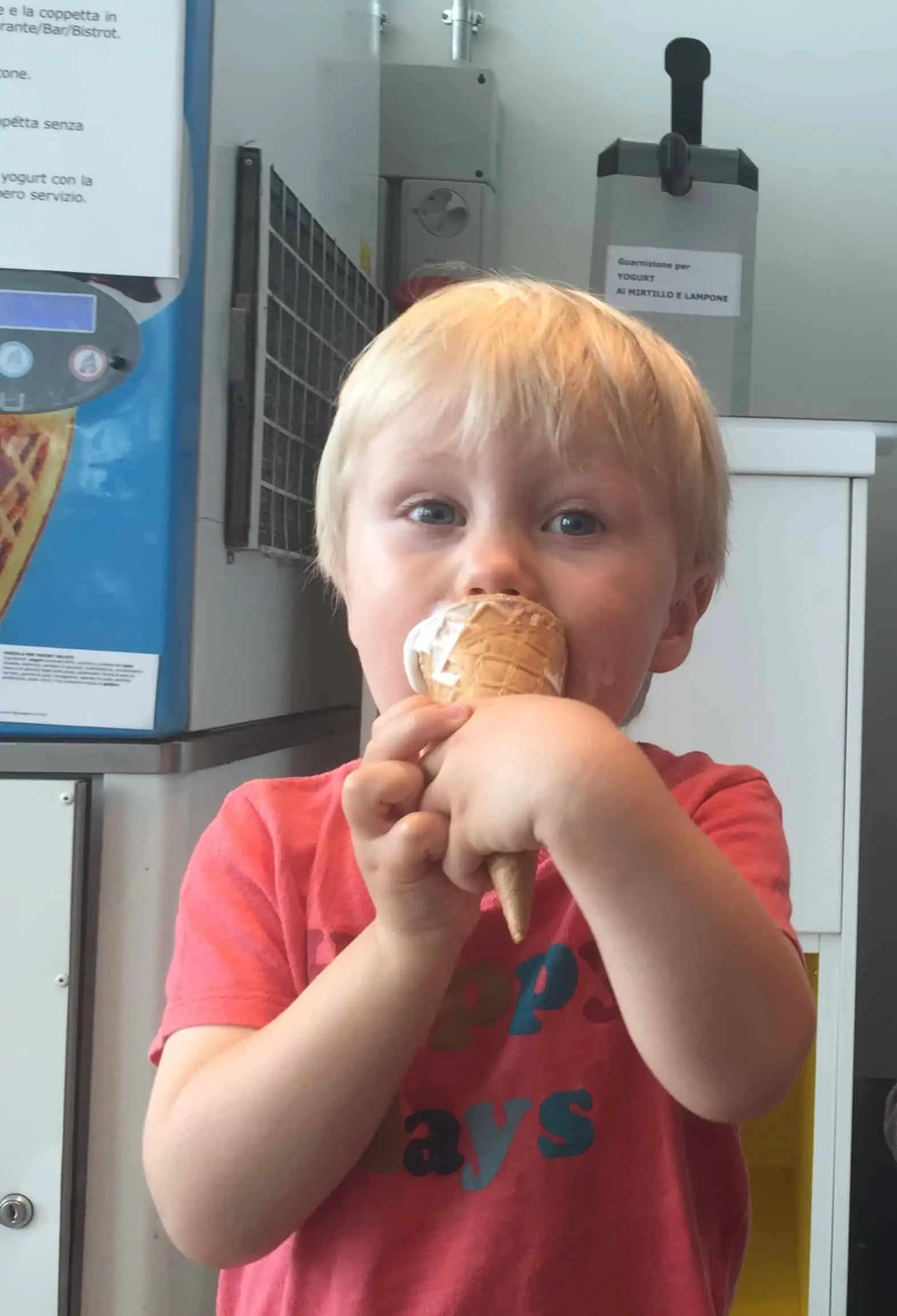 Little boy eating ice cream cone