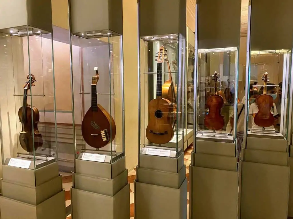 woodwind instruments in glass display cases at the Accademia Gallery in Florence, Italy