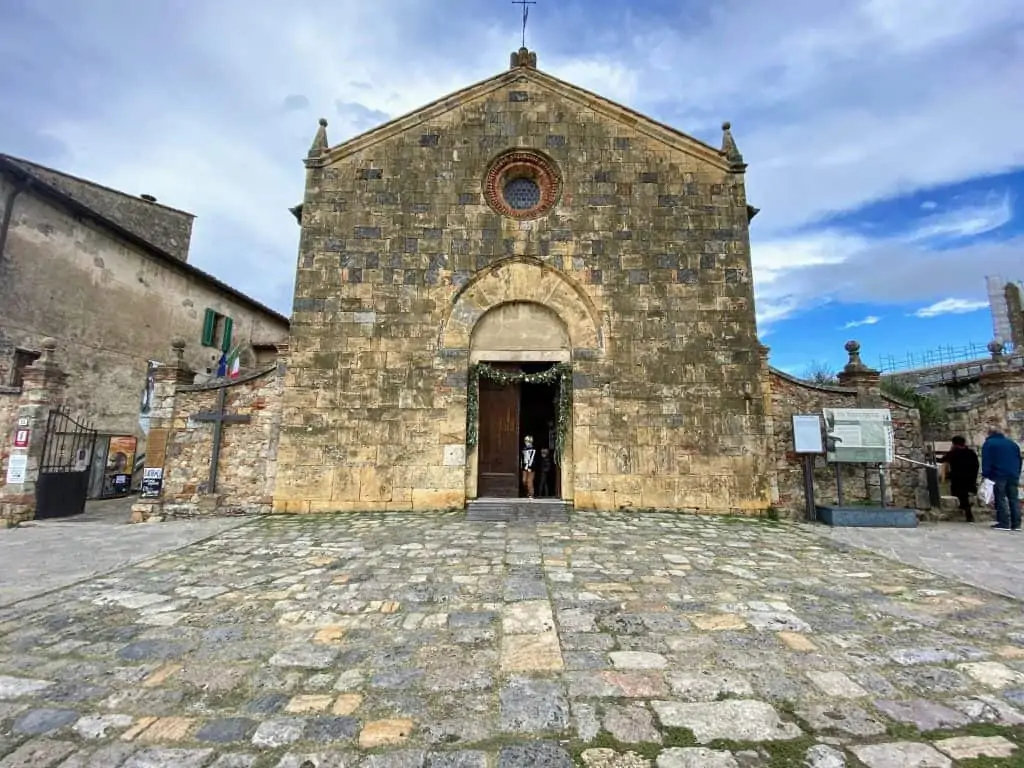 The facade of Pieve di Santa Maria Assunta, the main church in Monteriggioni, Italy.