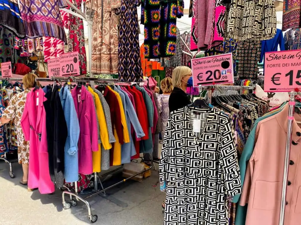 colorful coats on display at the market in forte dei marmi, italy