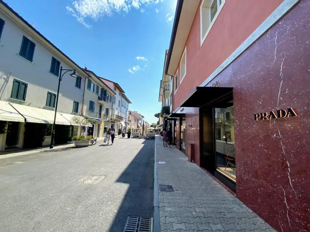 shopping street in forte dei marmi, italy, with prada on the right