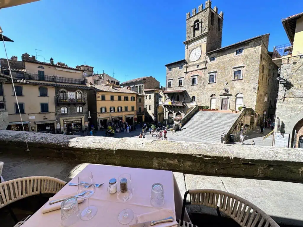 Restaurant table in Cortona, Italy overlooks the main square.