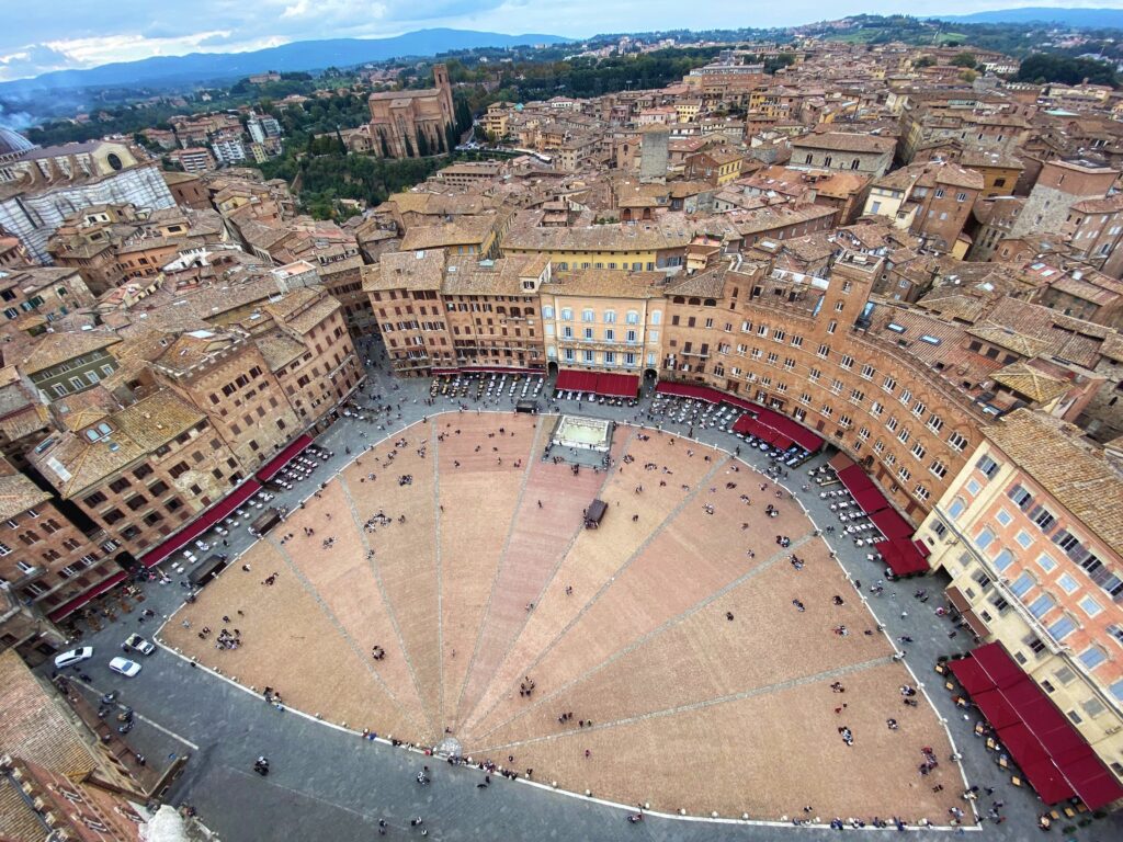 Checking out the view of Siena's Piazza del Campo from the top of the Torre del Mangia.