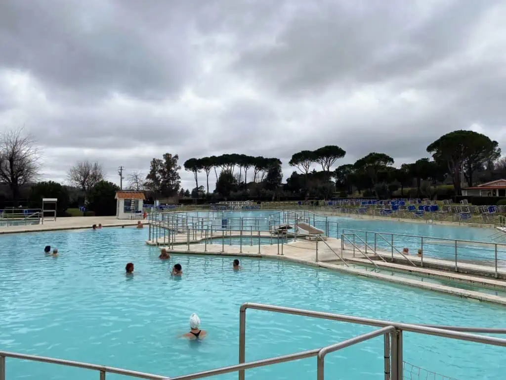 People soaking in the Saturnia Parco Termale (thermal park) in Tuscany, Italy.