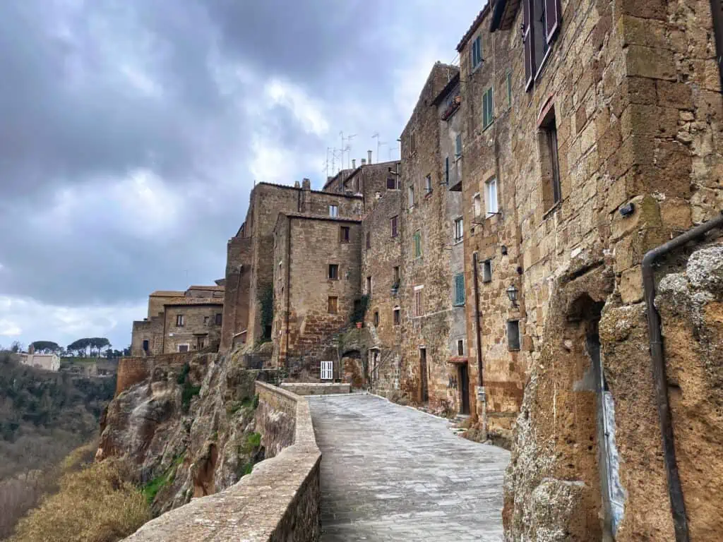 View of buildings and the outside wall of Pitigliano in southern Tuscany, Italy.