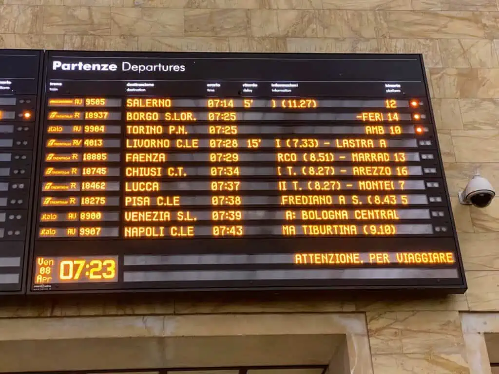 Digital departures board at the Florence Santa Maria train station in Florence, Italy.