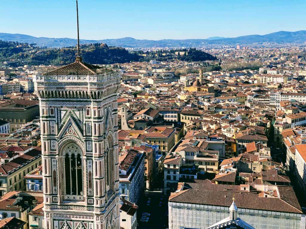 View of Giotto's bell tower and Florence rooftops from the Duomo climb in Florence, Italy.