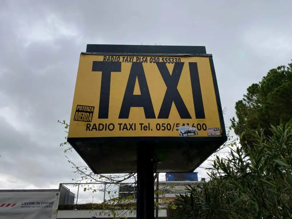 Close up of taxi sign at Pisa airport.