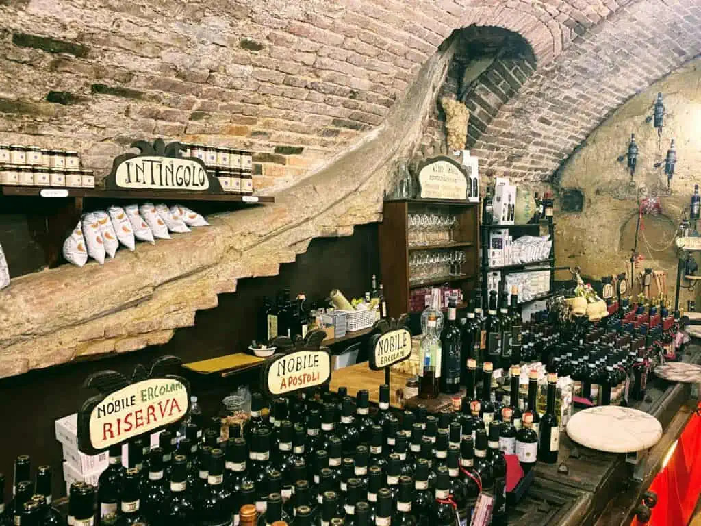 Wine display at an enoteca in Montepulciano, Tuscany.