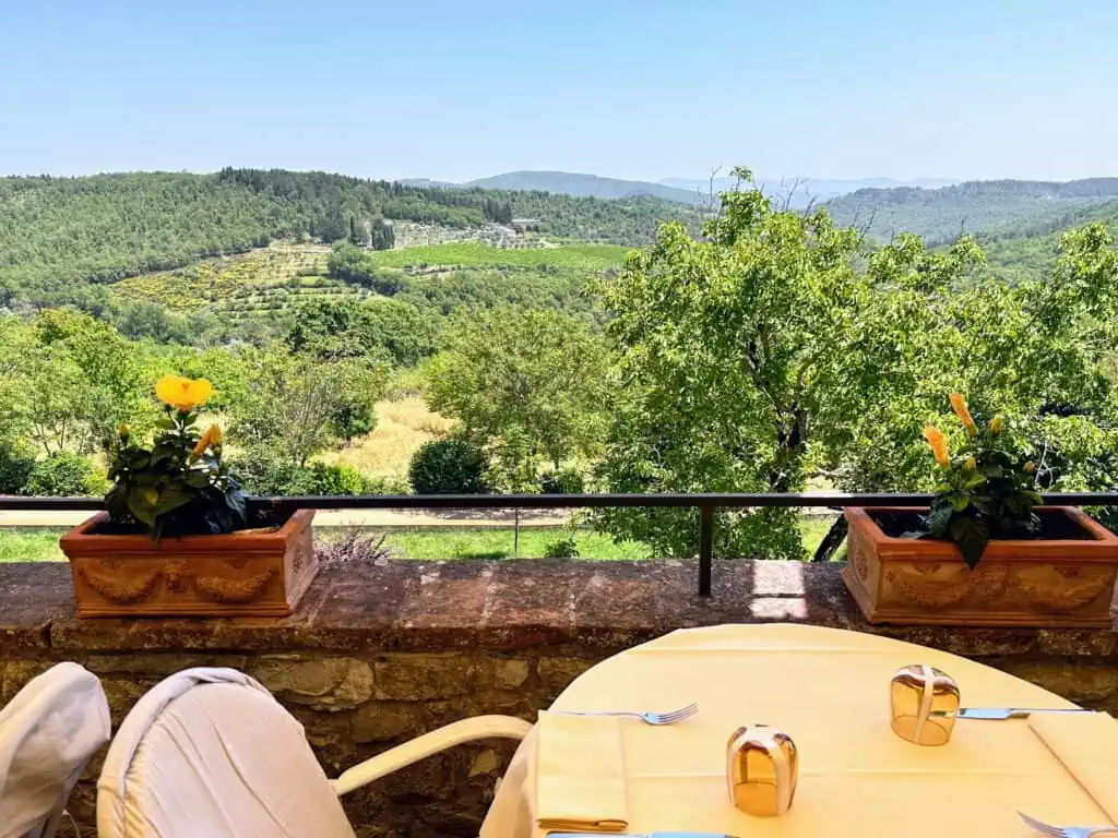 View of table and countryside from the terrace at Taverna Squarcialupi in Castellina in Chianti.