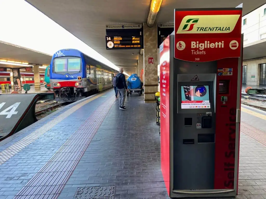 Regional train at the track at the Florence Santa Maria Novella train station in Italy.