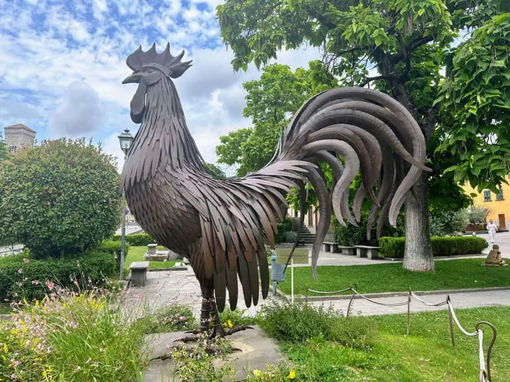 Metal rooster statue at entrance of Gaiole in Chianti in Tuscany, Italy.